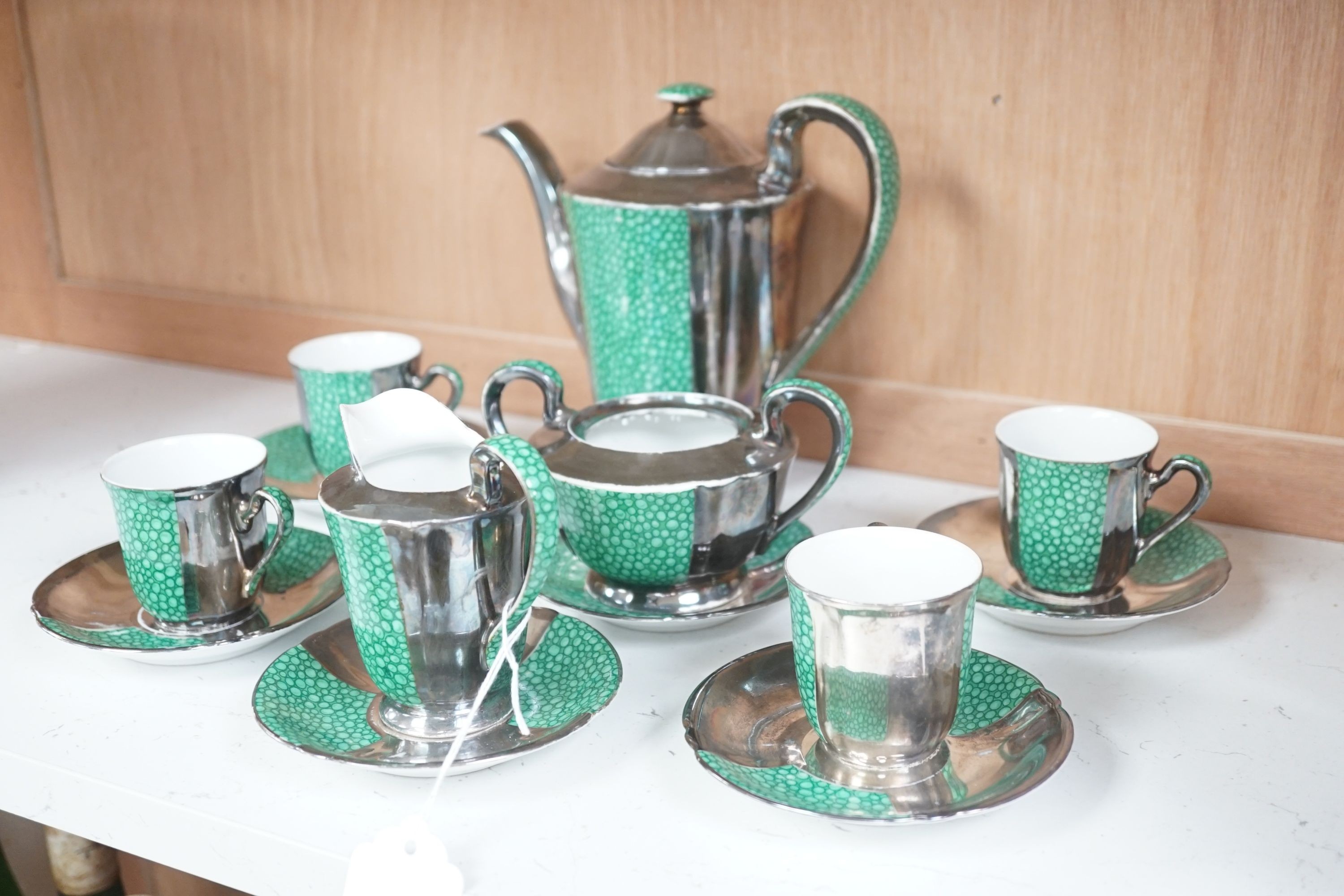 An Art Deco faux shagreen and silver lustre part tea set